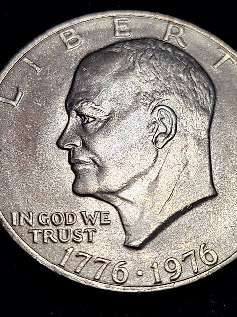 1976 Philadelphia Type 1 Eisenhower dollar reverse showing bold blocky sans-serif lettering design